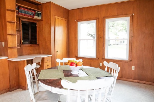 dining area with wooden walls