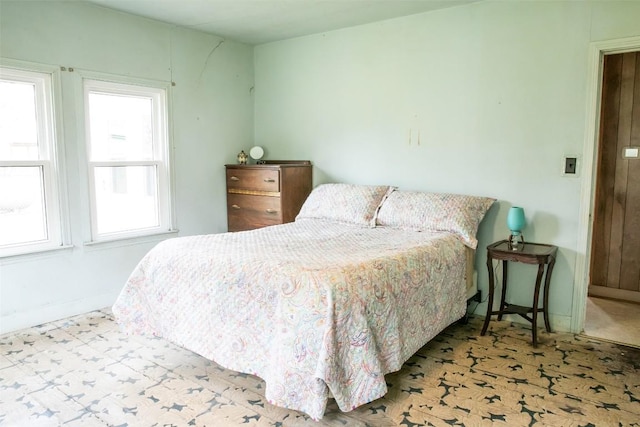 bedroom featuring baseboards