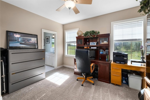 home office with baseboards, carpet floors, and ceiling fan