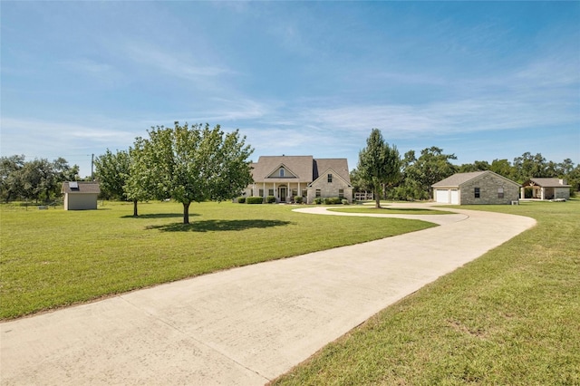 view of community with a yard and a garage