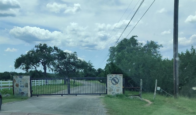 view of gate featuring fence