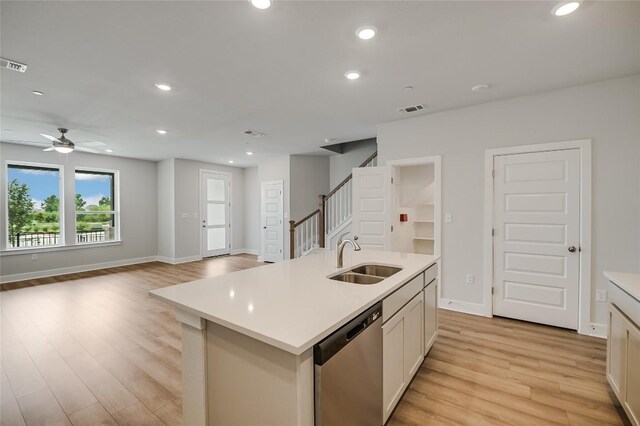 503 Emory Crossing Blvd, Hutto, TX 78634 - kitchen featuring a sink, stainless steel dishwasher, light wood-style floors, light countertops, and recessed lighting