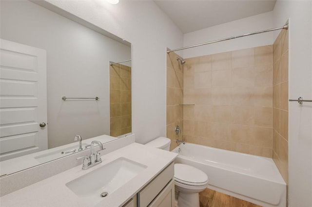 503 Emory Crossing Blvd, Hutto, TX 78634 - full bathroom with toilet, wood finished floors, shower / bath combination, and vanity