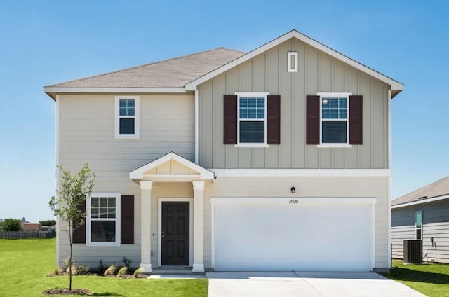 view of front facade with a front lawn, board and batten siding, concrete driveway, a shingled roof, and a garage