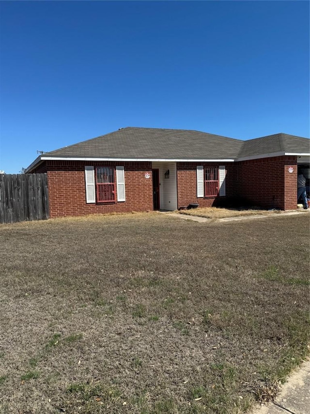 ranch-style house with brick siding and fence