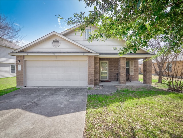 view of front of house with a front yard, an attached garage, brick siding, and driveway