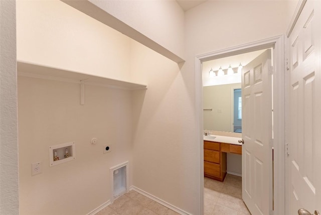 clothes washing area featuring light tile patterned floors, gas dryer hookup, hookup for an electric dryer, laundry area, and washer hookup