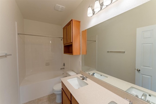 bathroom featuring tile patterned flooring, toilet, shower / tub combination, double vanity, and a sink