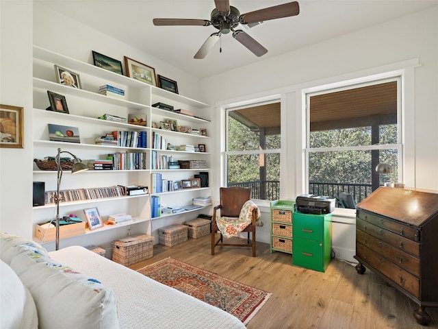 sitting room featuring ceiling fan and wood finished floors