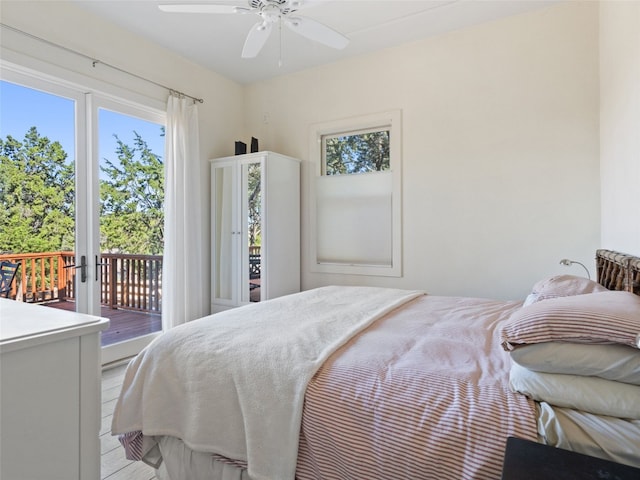 bedroom with ceiling fan and access to exterior