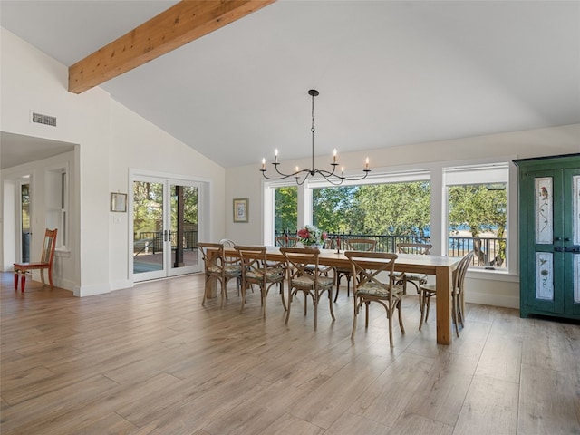 dining area featuring a notable chandelier, visible vents, light wood-type flooring, and beam ceiling