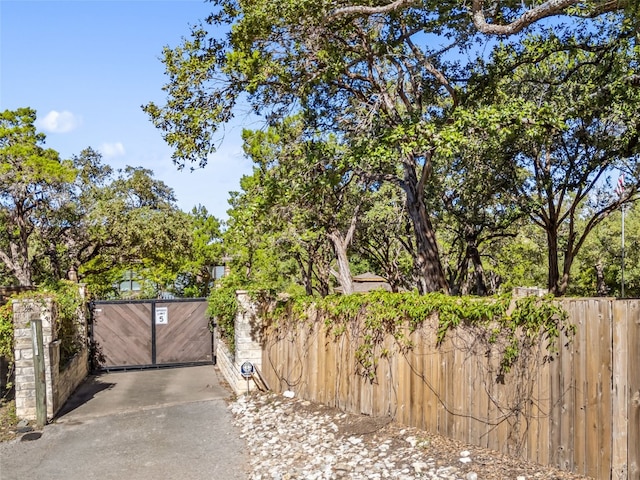 view of gate with fence