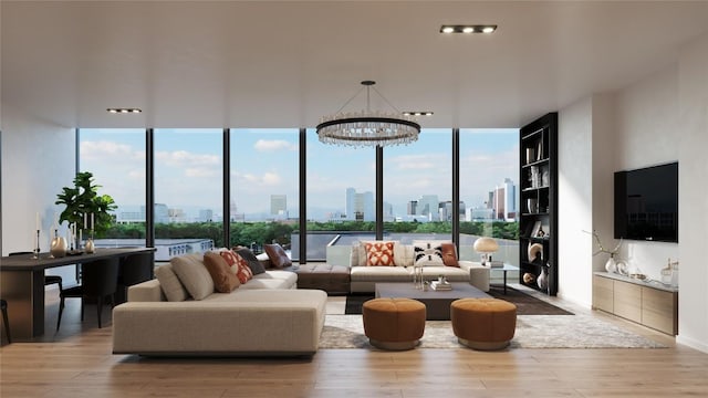 living room with a wall of windows, plenty of natural light, and wood finished floors