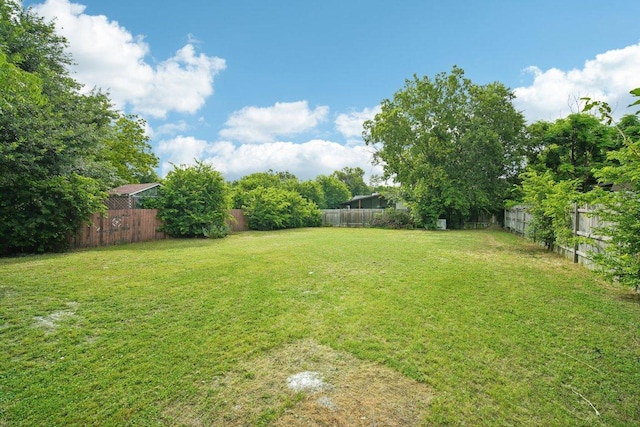 view of yard featuring a fenced backyard