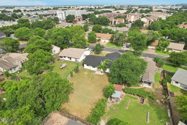 birds eye view of property with a residential view