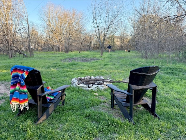 view of yard with a fire pit