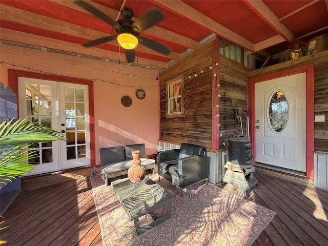 deck with french doors and a ceiling fan