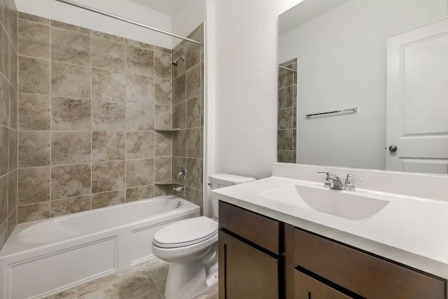 bathroom with tile patterned flooring, toilet, vanity, and bathtub / shower combination