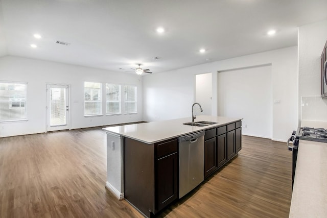 kitchen featuring visible vents, stainless steel appliances, wood finished floors, and a sink