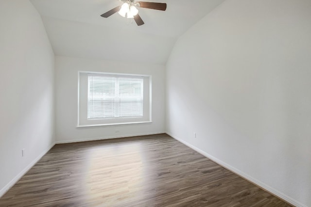 spare room with ceiling fan, baseboards, lofted ceiling, and wood finished floors