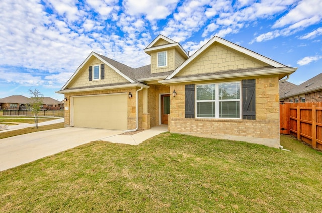 view of front of home with a front yard, fence, a garage, and driveway