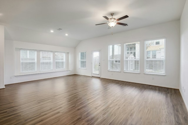 unfurnished living room with dark wood-type flooring, a ceiling fan, recessed lighting, baseboards, and vaulted ceiling