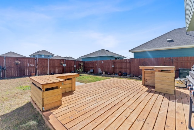 deck with a fenced backyard