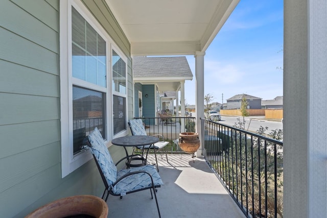 balcony featuring a residential view