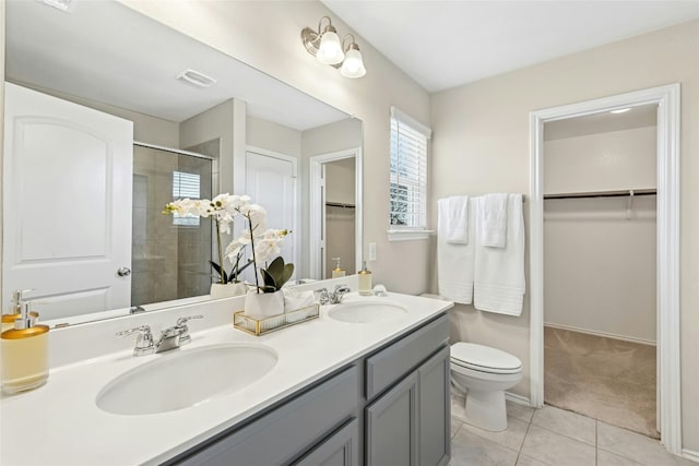 full bath with tile patterned floors, visible vents, a shower stall, and a sink