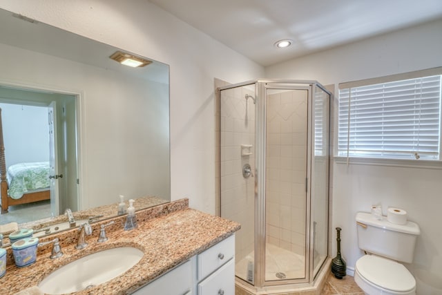 bathroom featuring recessed lighting, vanity, toilet, and a shower stall