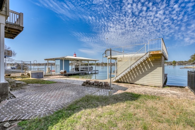 dock area featuring stairs and a water view