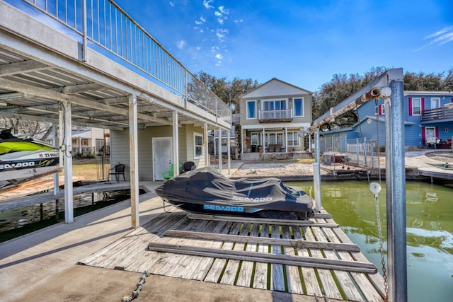 exterior space with a water view and boat lift