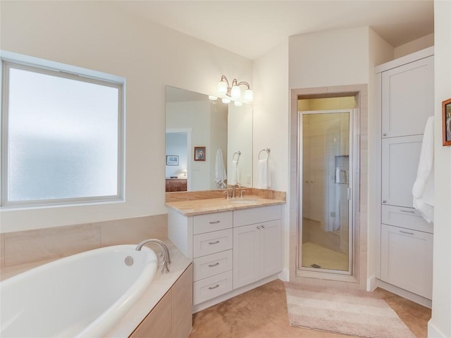 full bathroom with vanity, a garden tub, a stall shower, and tile patterned flooring