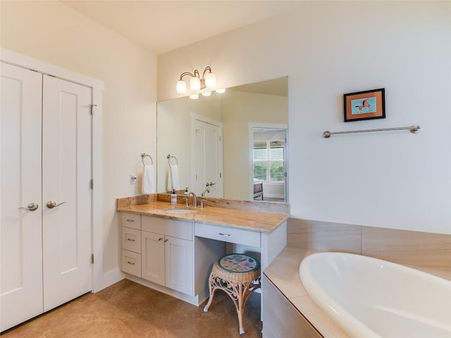 full bath featuring a tub and vanity