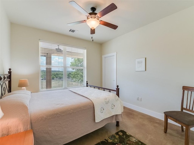 carpeted bedroom featuring visible vents, baseboards, and a ceiling fan