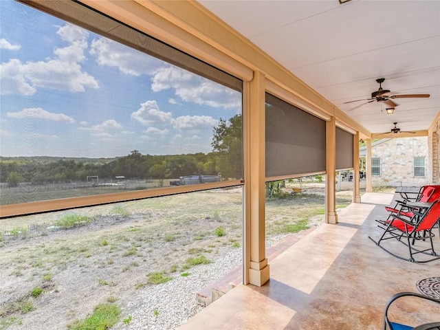 view of patio featuring a ceiling fan