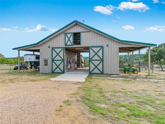 view of outbuilding featuring an outbuilding and an exterior structure