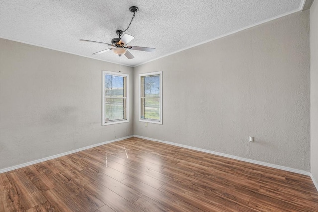 172 Hershal Ln, Cedar Creek, TX 78612 - empty room featuring a textured ceiling, wood finished floors, a ceiling fan, and ornamental molding