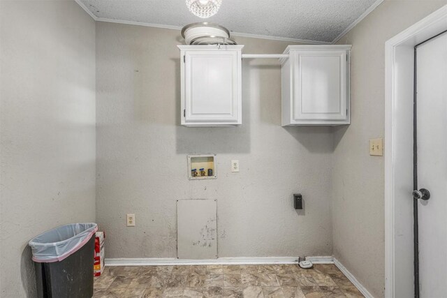 washroom featuring hookup for an electric dryer, a textured ceiling, baseboards, and washer hookup