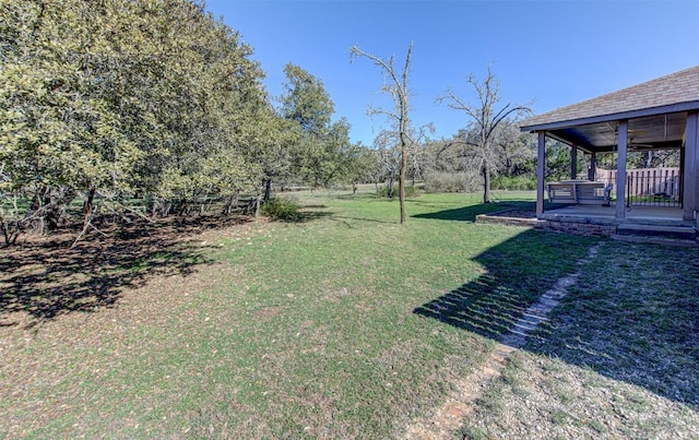 view of yard featuring a ceiling fan