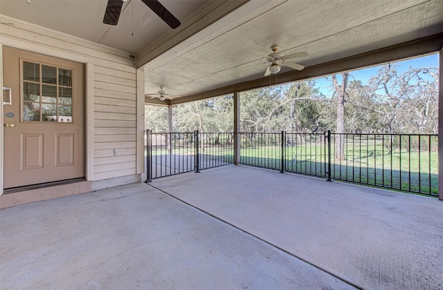 view of patio / terrace with a gate, fence, and ceiling fan