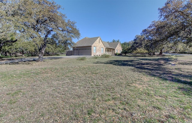 view of property exterior with a lawn and an attached garage