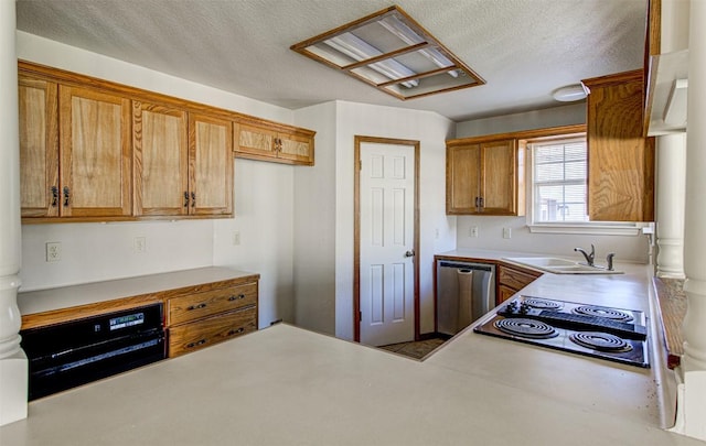 kitchen featuring a sink, black appliances, light countertops, a textured ceiling, and brown cabinets