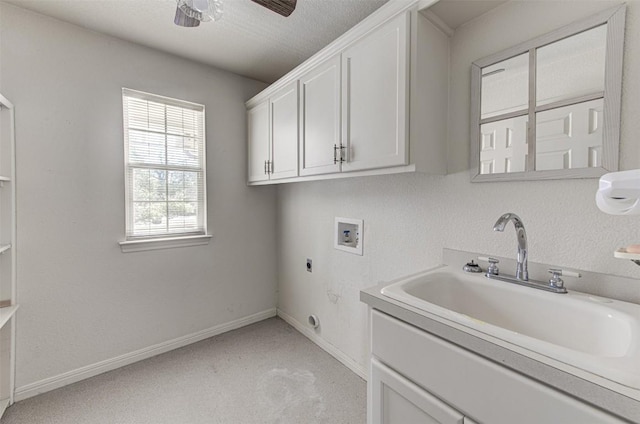 washroom with hookup for a washing machine, baseboards, hookup for an electric dryer, cabinet space, and a sink