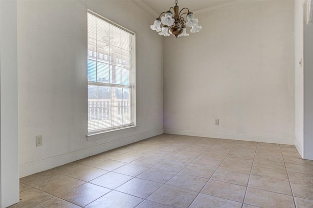 spare room with ornamental molding, baseboards, light tile patterned floors, and a chandelier