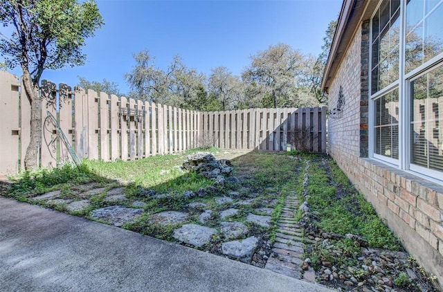 view of yard with a fenced backyard