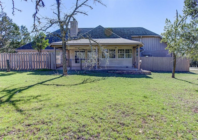 back of house with a yard, a patio area, and fence