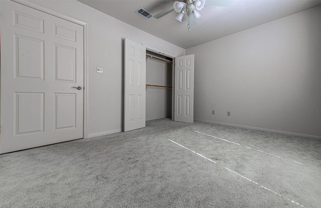 unfurnished bedroom with visible vents, baseboards, carpet, ceiling fan, and a closet