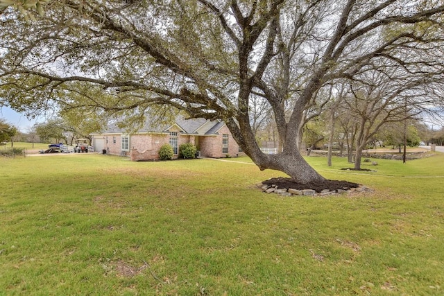 view of yard featuring an attached garage