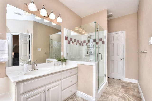 full bath featuring visible vents, a shower stall, vanity, and baseboards